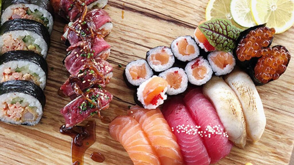 Colorful sushis on a wooden board