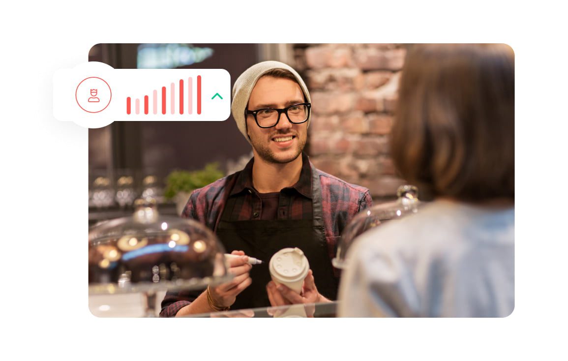 Restaurant worker serving coffee to customer